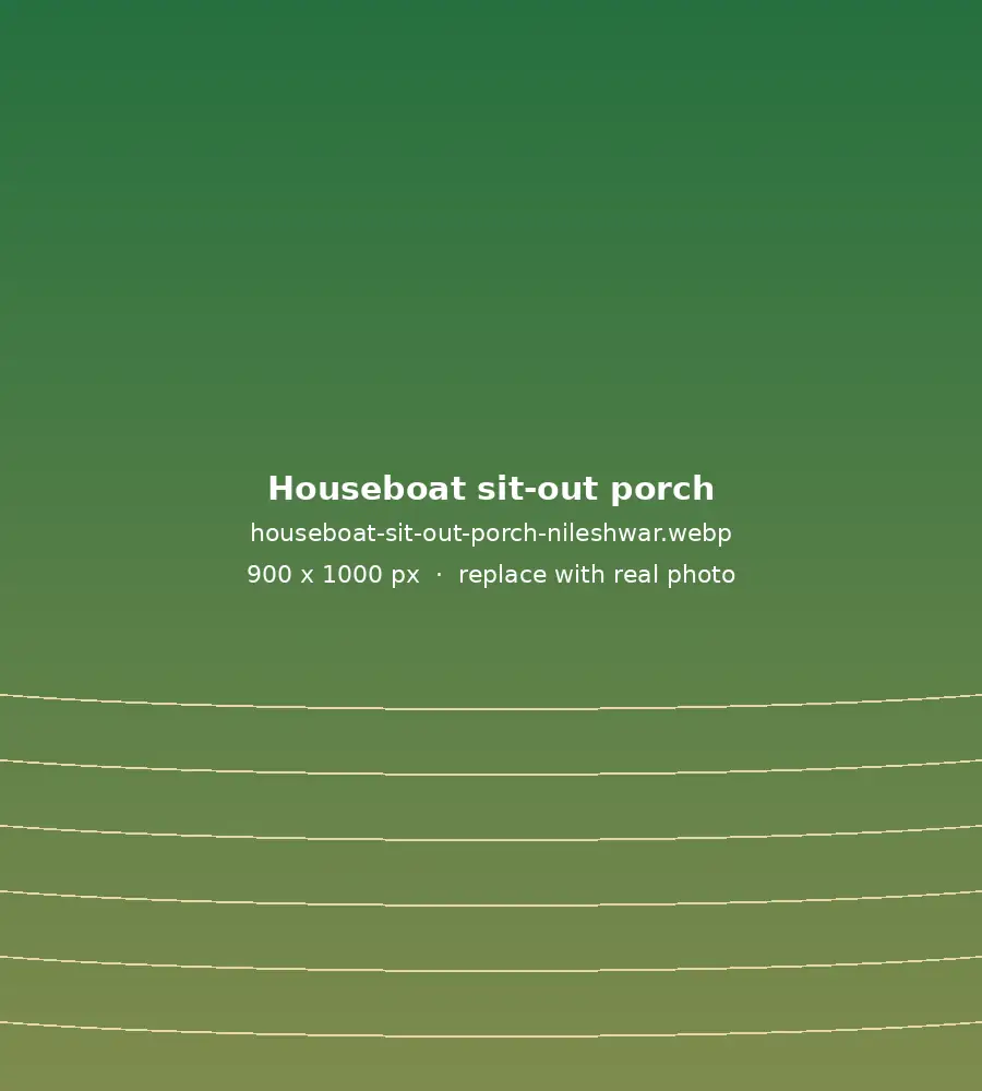 Sit-out porch with easy chairs on a Nileshwar houseboat